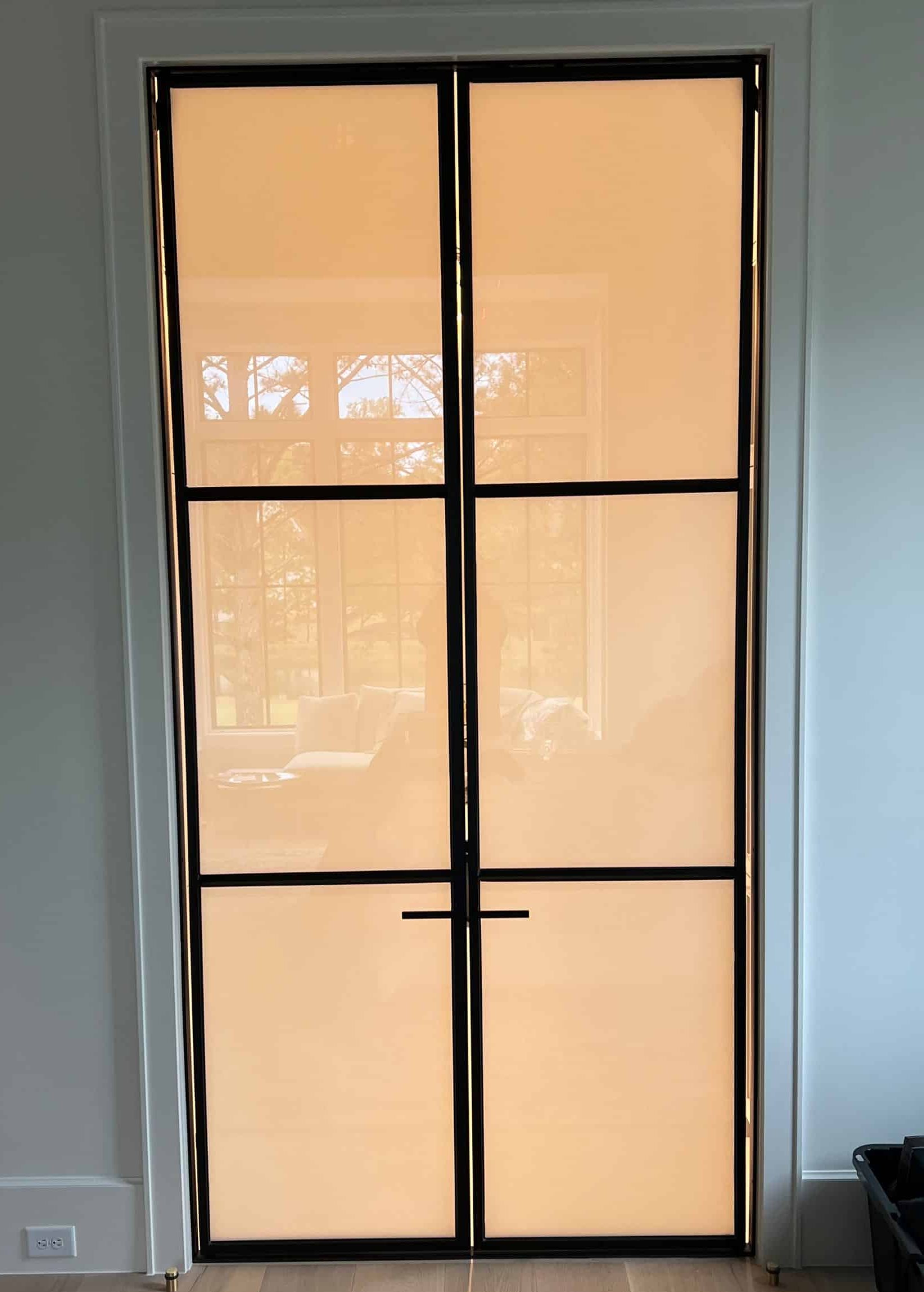 Modern residential electronic window tint installed on glass doors, providing a smart window tint for home privacy with instant frosted effect.